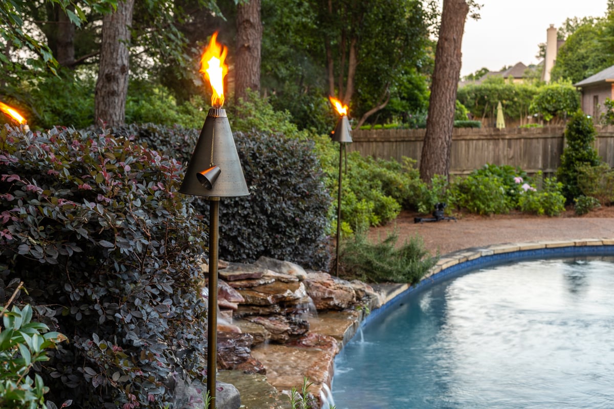 Tiki Torch lights by pool