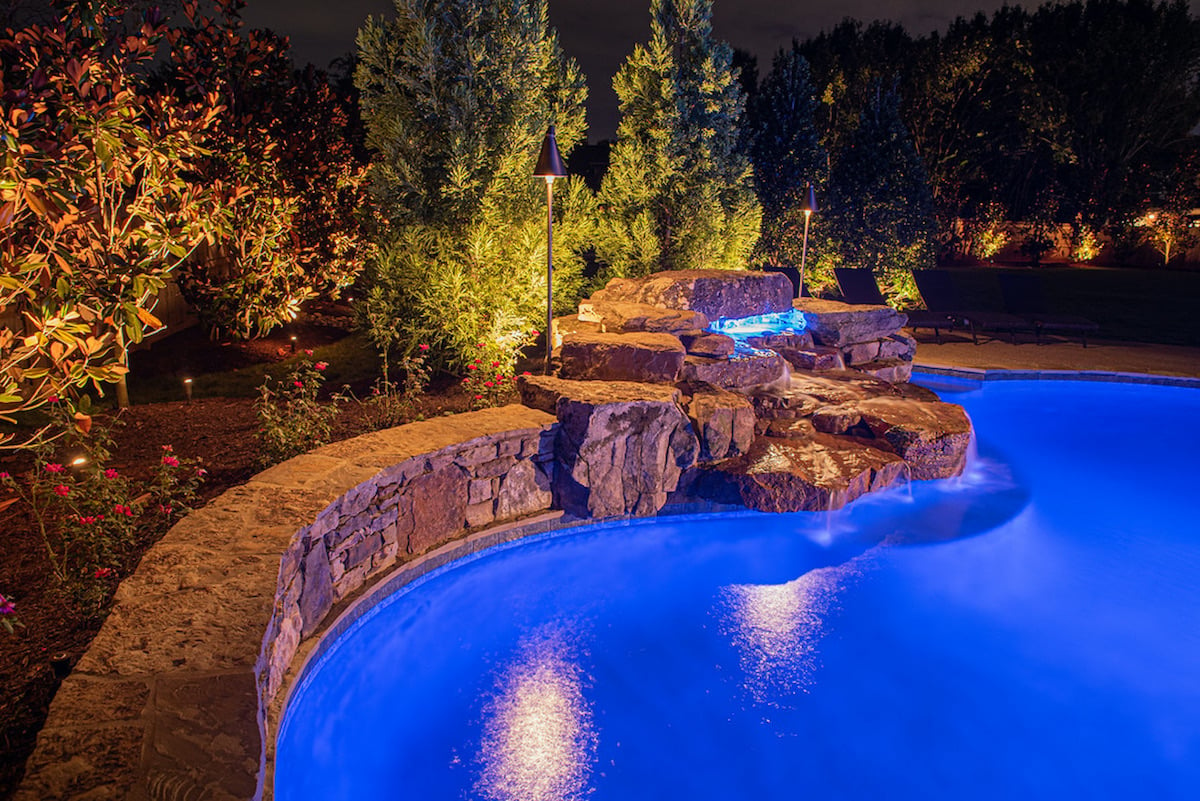 Pool and Landscape Lighting with lighted waterfall