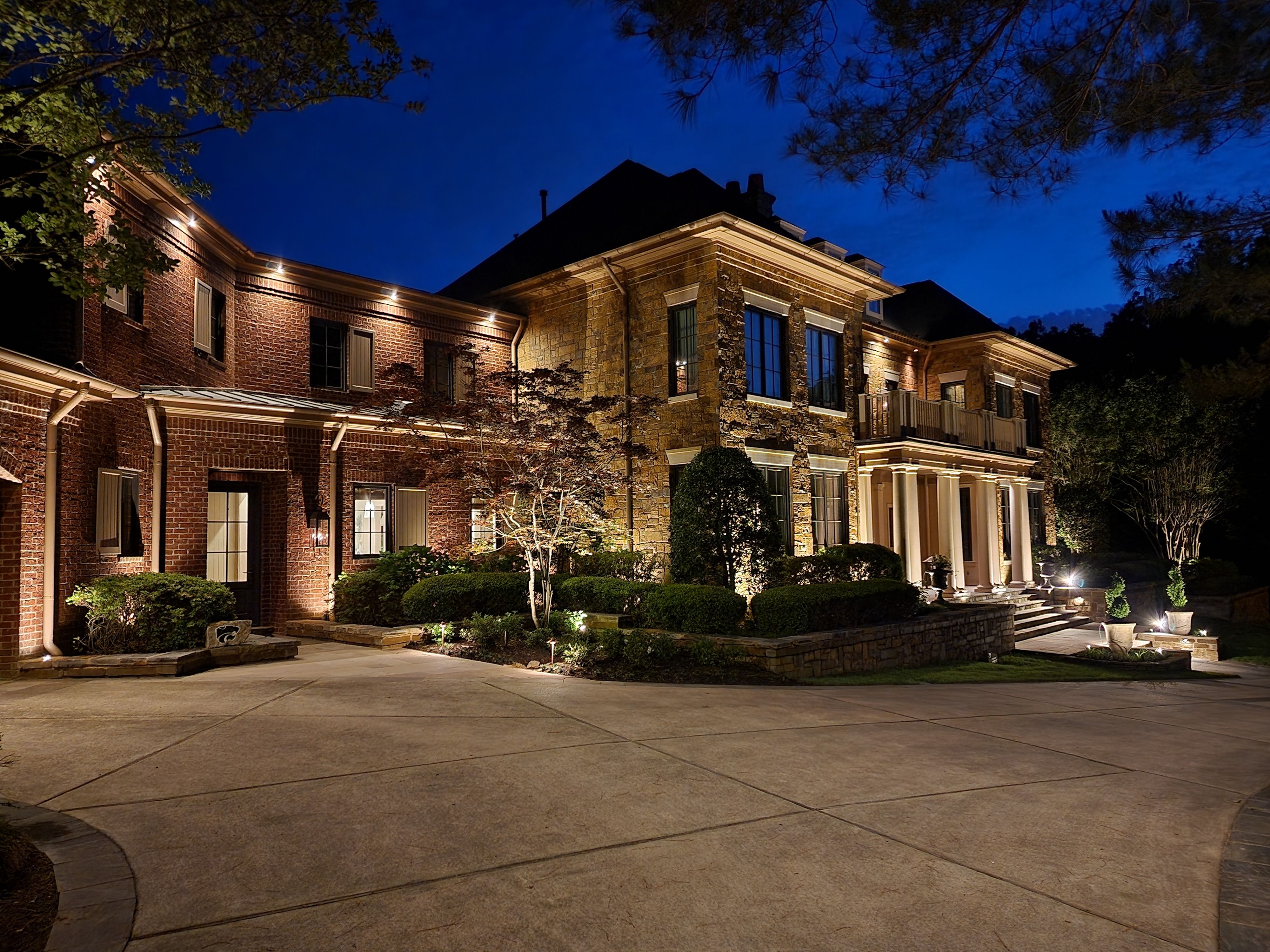 outdoor lights shining on house in a custom design